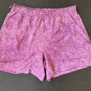 Lululemon men’s Pace Breaker Linerless shorts. Size XL in magenta and white.